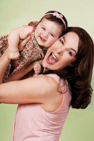 Loving Mother and baby singing and bonding, enjoying Kindermusik baby music classes in Burgess Hill